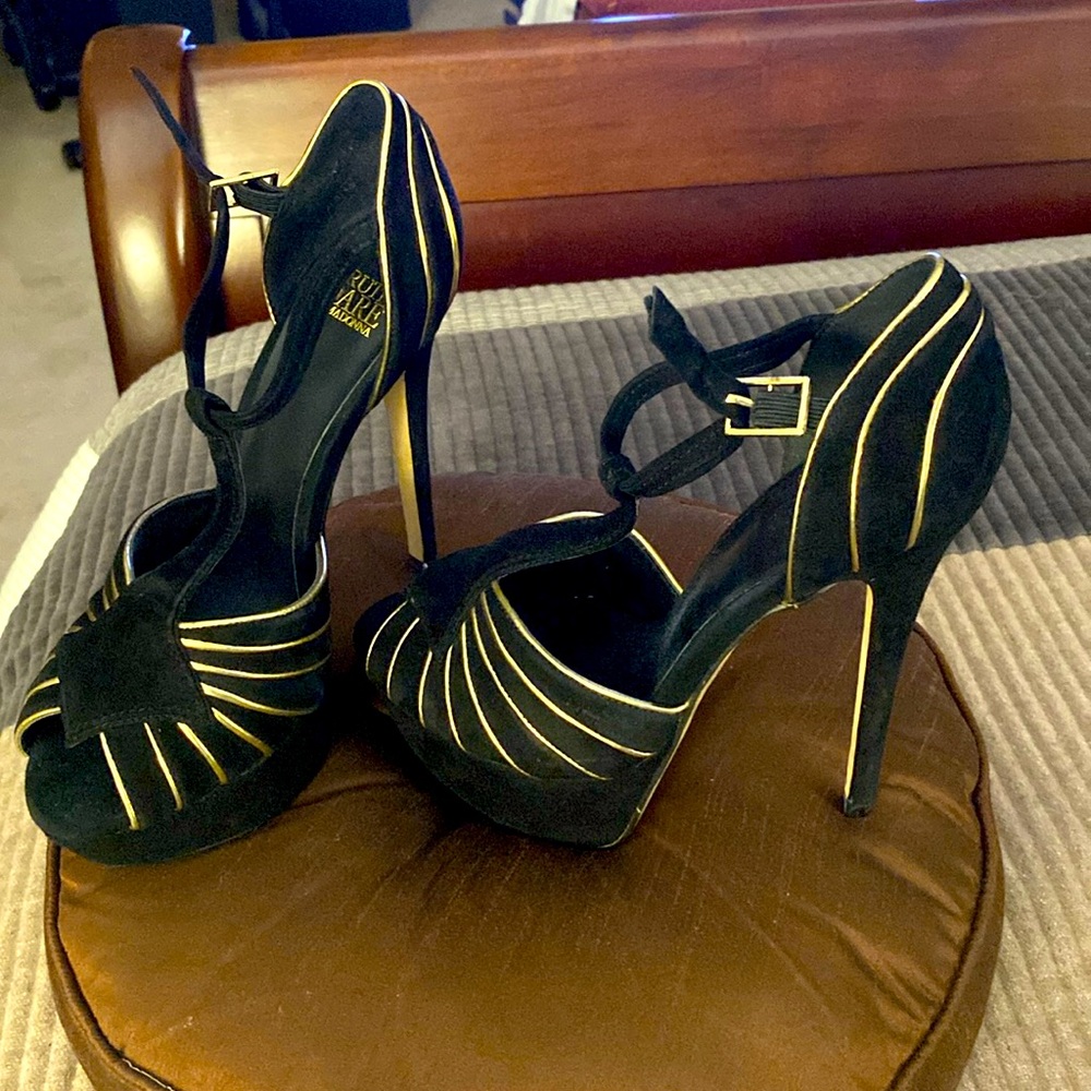 Women’s high heels in black suede with gold trim